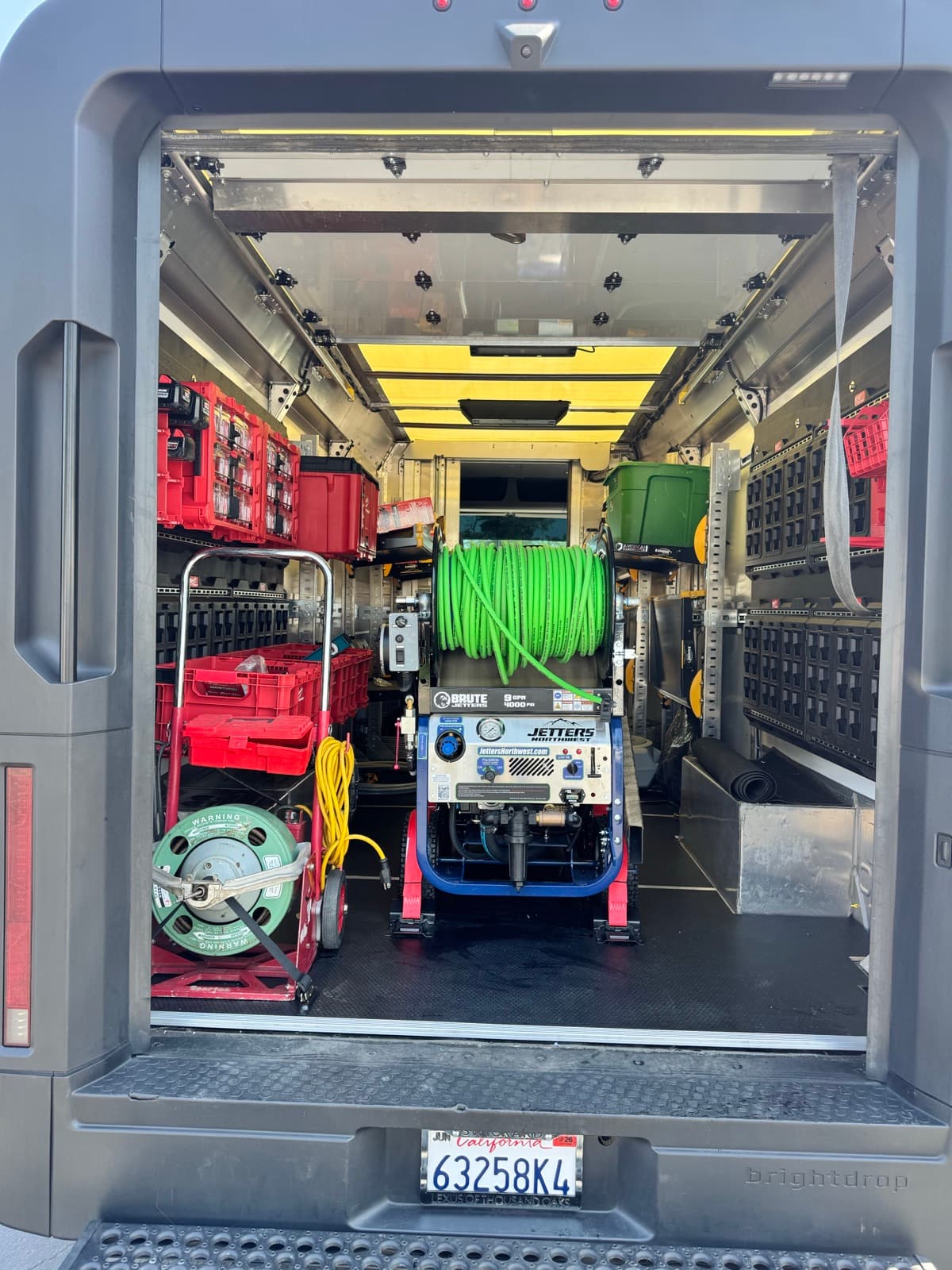 Biz-E-Bee van loaded with hydro-jetting equipment ready for drain and sewer work